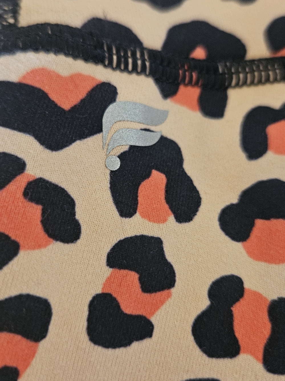 Fabletics PowerHold Leopard Print Leggings in Cream, Black & Orange - Picture 7 of 8
